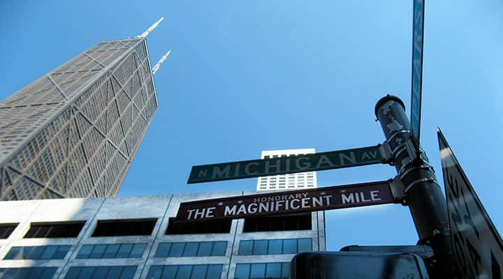 chicago magnificient mile street sign in front of John Hancock building